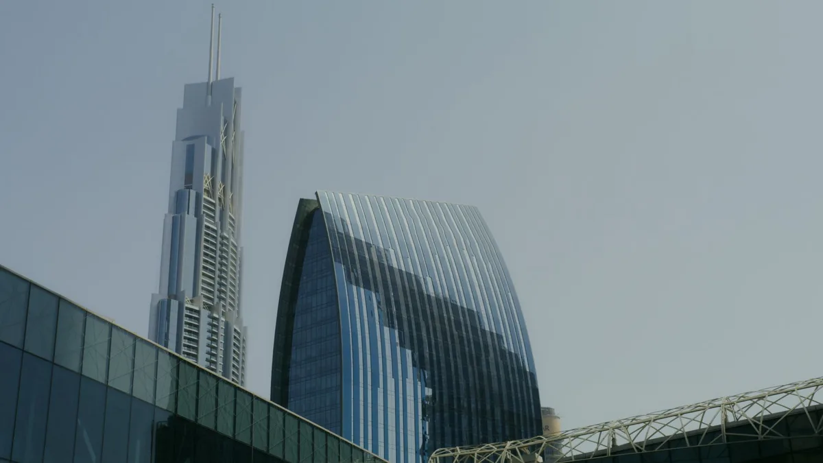 Modern glass skyscrapers in a UAE business district skyline