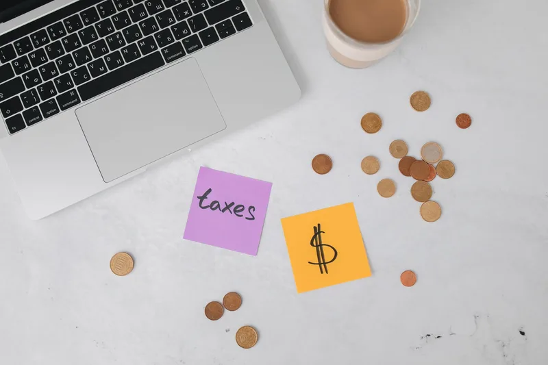 Professional businesswoman reviewing financial documents outdoors in a city environment — understanding Dubai's tax system is essential for every expatriate moving to the UAE
