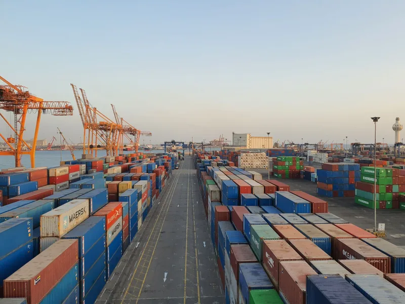 A bustling port scene with cargo containers